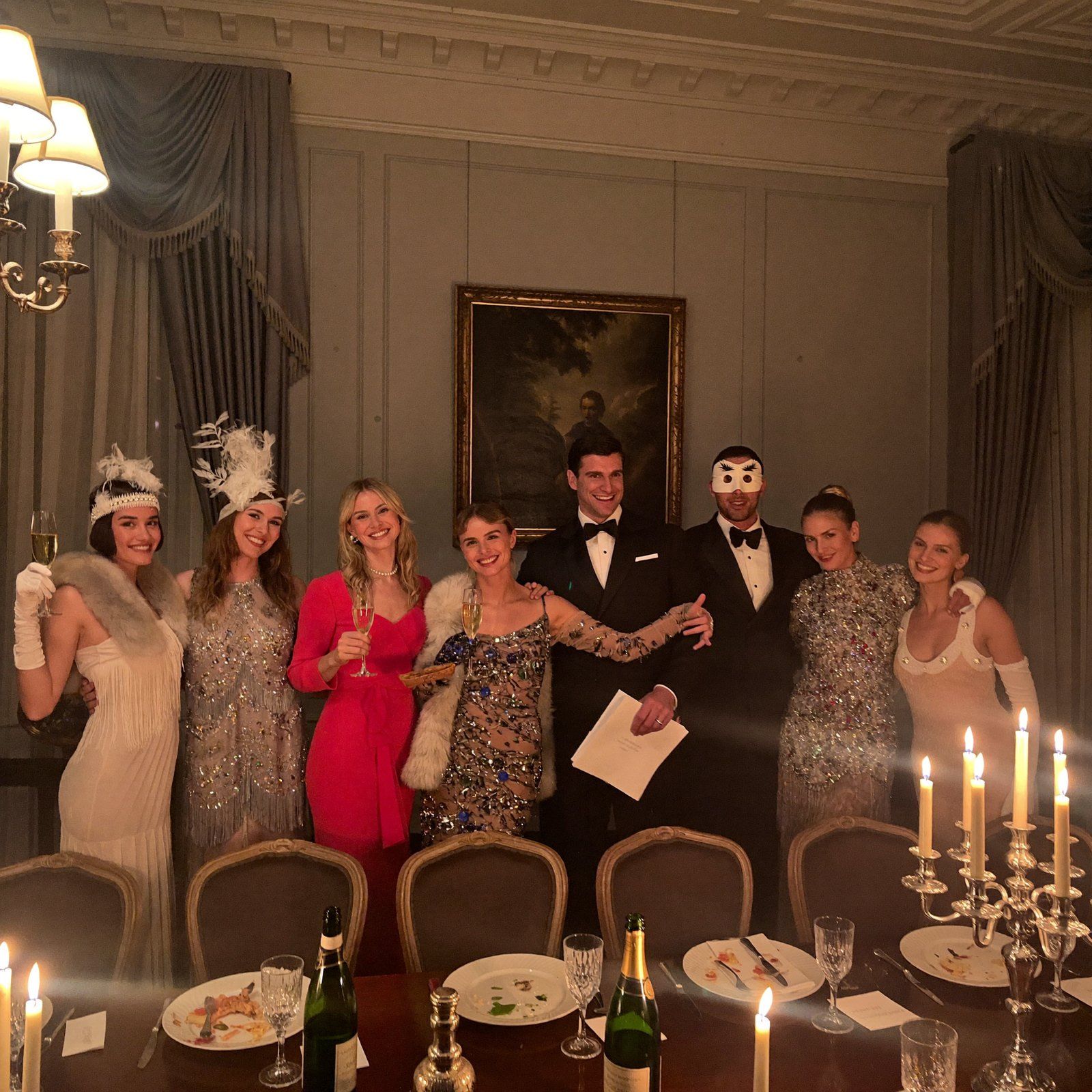 The table raising a toast in costume
